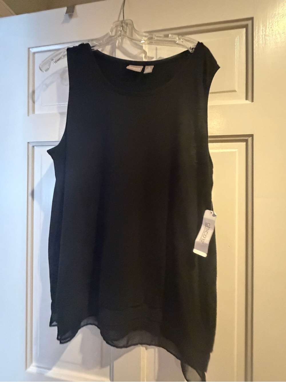 Woman black sleeveless top. Chico’s